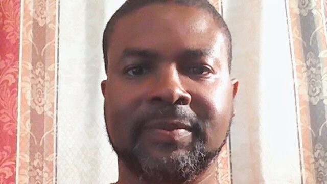 Dr. Lorenzo Neal selfie in a Wear Orange t-shirt