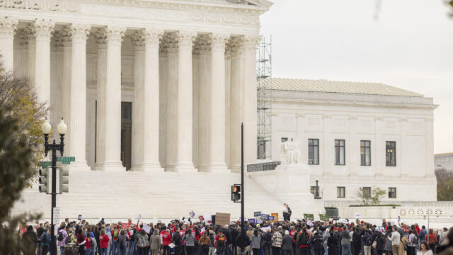 A large group of Moms Demand Action volunteers and other gun violence prevention advocates rally in front of the Supreme Court.