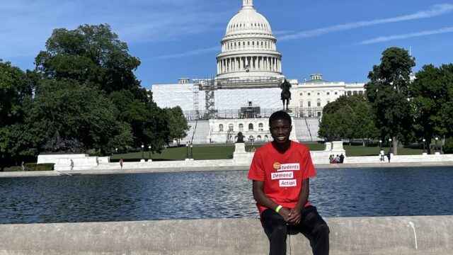 Jakoby Mitchell poses for a photo in front of the U.S. Capitol