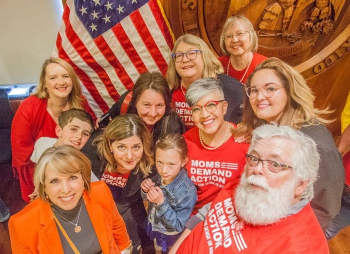 Gov. Lujan Grisham poses for a picture with a group of Moms Demand Action volunteers