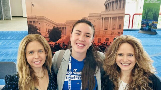 The three co-founders of Teachers Unify To End Gun Violence pose in front of a poster at a conference. All three are women.
