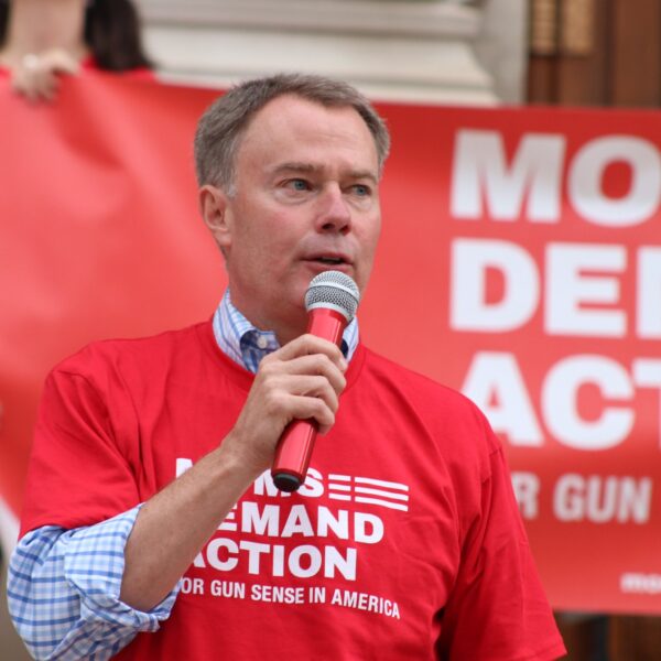 Mayor Hogsett speaks while wearing a Moms Demand Action shirt at a rally