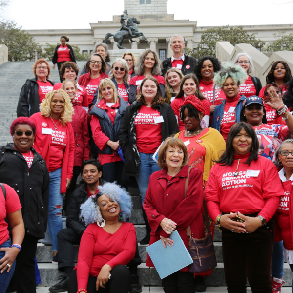 Moms Demand Action volunteers pose for a photo on the steps of the Tennessee State House